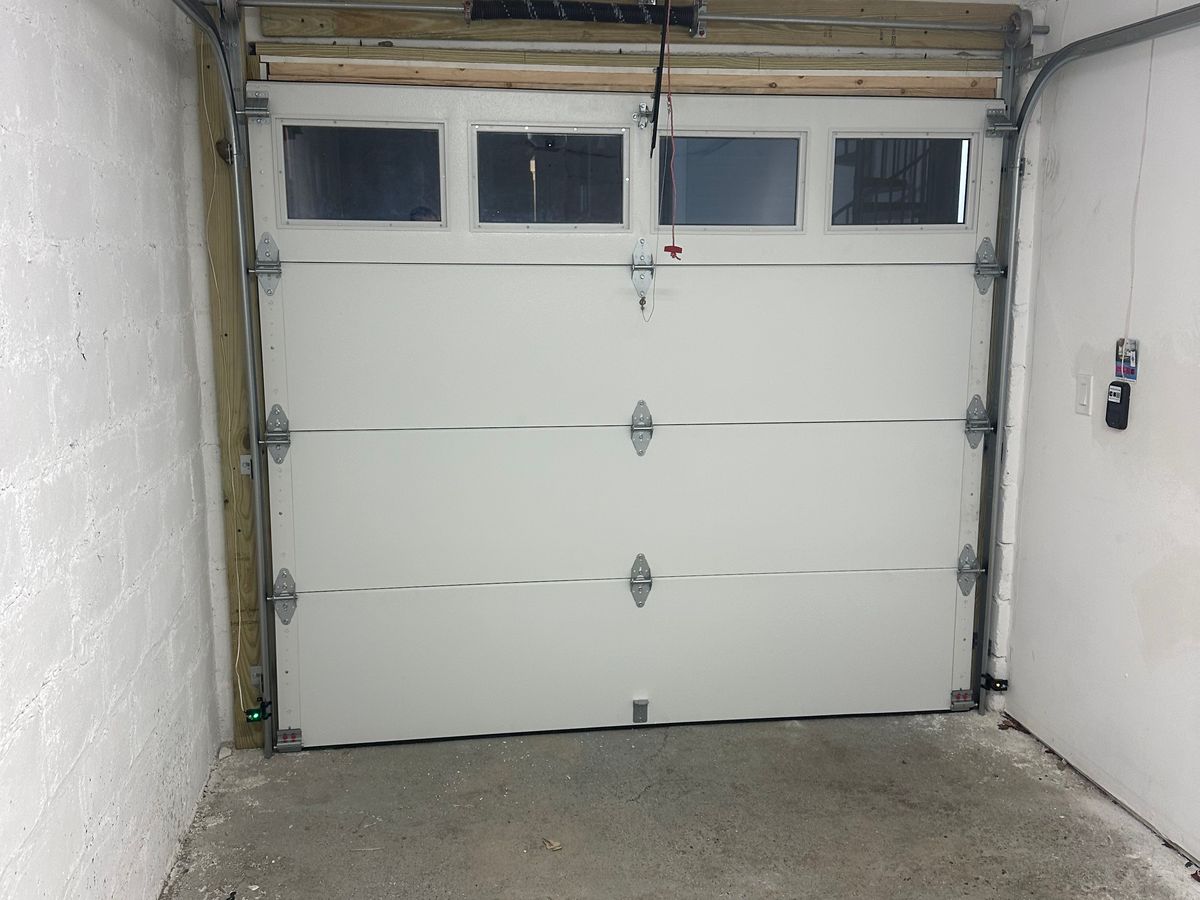 White commercial door with glass windows installed from interior view