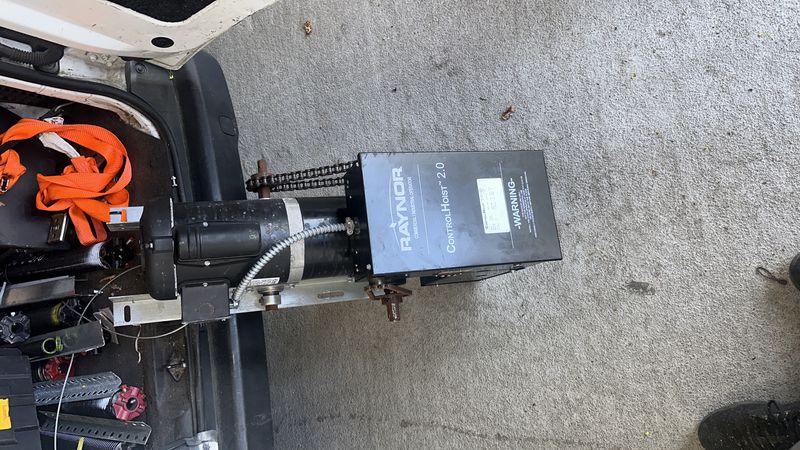 Raynor ControlHoist 2.0 commercial opener loaded on service van for installation